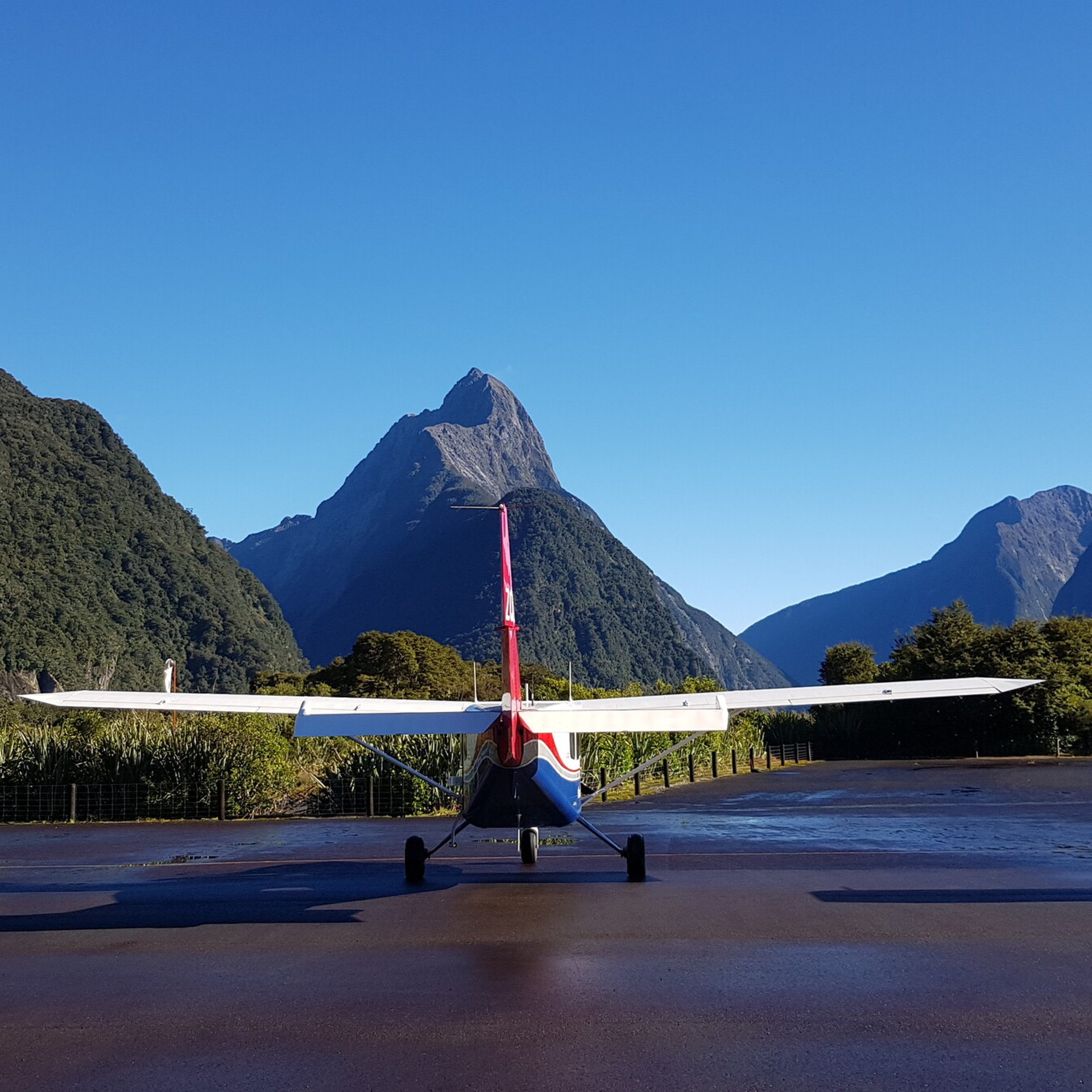 Small plane landing at Milford Sound