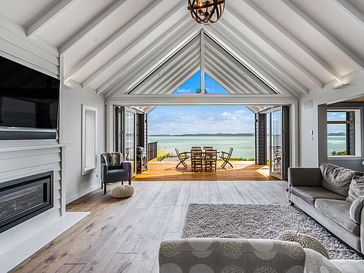 View through main living area to the sea of Pohutakawa house. Beachlands