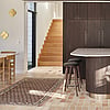 Shift House kitchen area with wooden stairs to upper floor