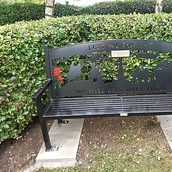 A laser cut memorial bench bolted down to slabs with anti tamper fittings.