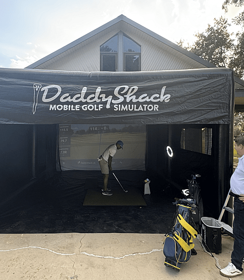Man using Louisiana mobile golf simulator