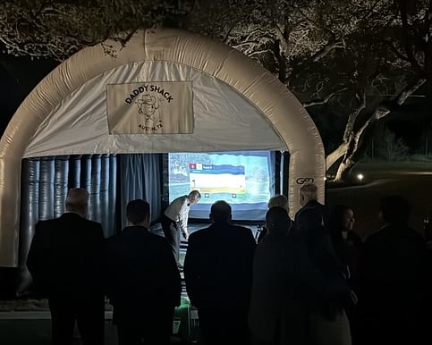 Wedding party in Austin enjoying golf simulator
