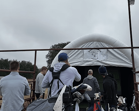 Bachelors enjoying golf simulator in Austin