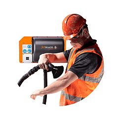 Man stepping out of a personnel cleaning booth in full PPE gear (air blower technology in background)