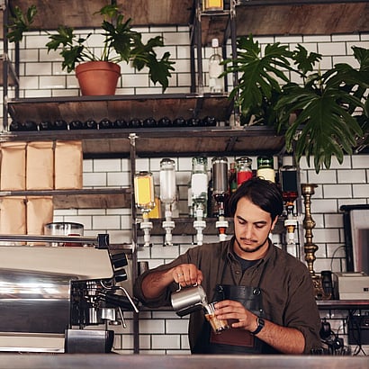 Image of an a Coffee Barista where Food and Beverage Fire Protection Systems are required - Holisitic Fire Services