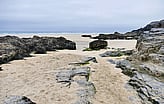 Sandy rocks within a Marine environment