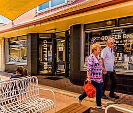 Village walk with shops and seating areas