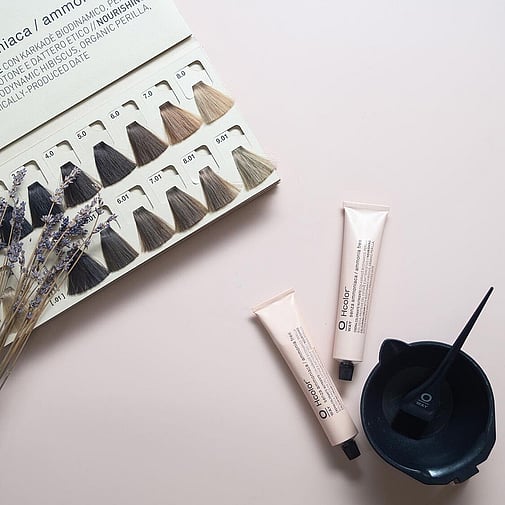 Organic hair colour on counter with colour swatches and lavender.