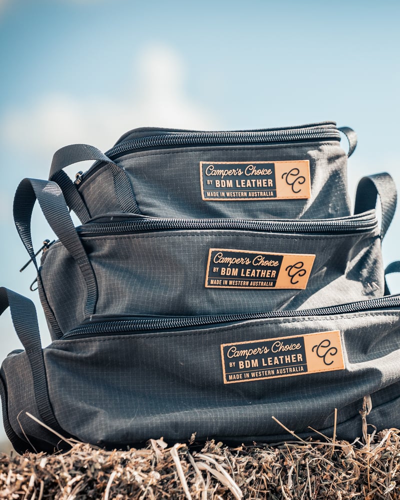 Stack of three charcoal ripstop canvas clear top storage bags in small, medium and large sizes, each with a Camper's Choice Made in Western Australia badge
