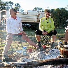 Riders around camp fire