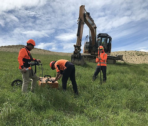 3 Scientists Investigating Landfill
