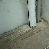 Asbestos insulation to pipe work within an airing cupboard