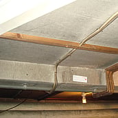 Asbestos cement sheets to a ceiling