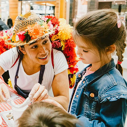 Man wearing Straw Hat leading Activities