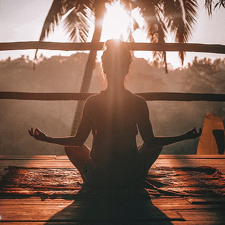 Woman silhouette meditating