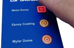 Pressing a backlit membrane switch