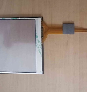 Capacitive touch screens with peel and place adhesive