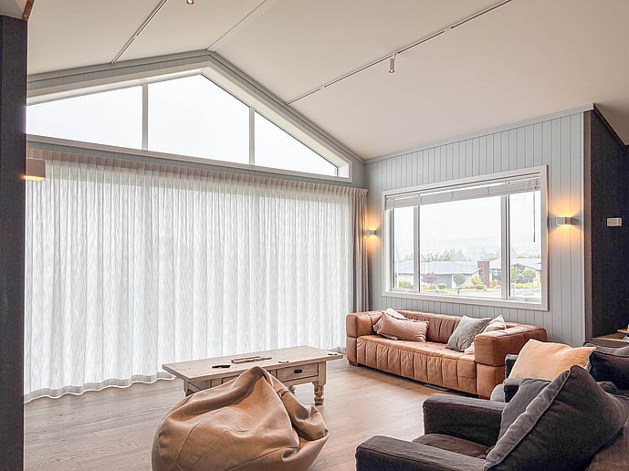 living area with large full height gable window