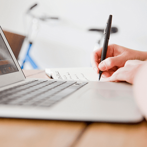 Writing next to a laptop