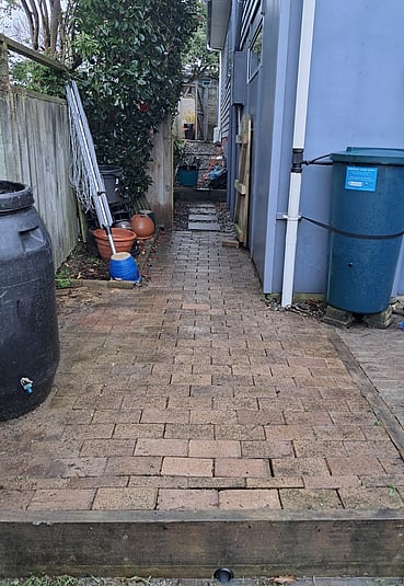 Paving stone pathway next to a house