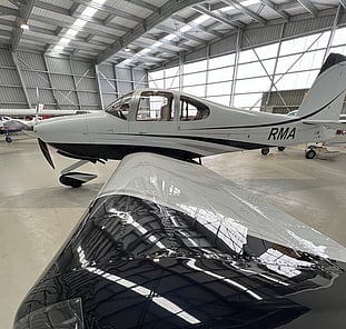 Small aircraft in hangar