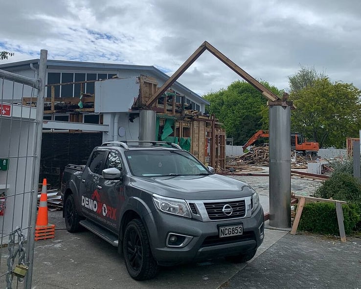 Demoworx ute parked at a demolition site