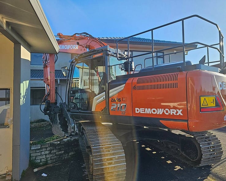 Close-up of a Demoworx excavator on site