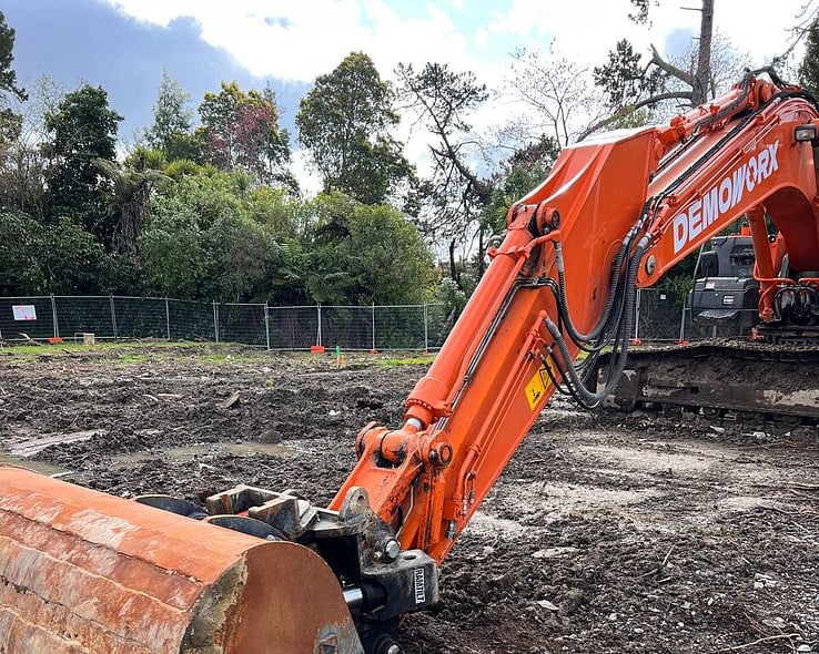 Excavator working on a cleared site