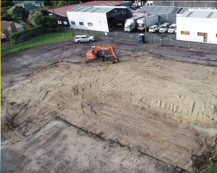 Aerial view of a commercial site cleared to bare ground