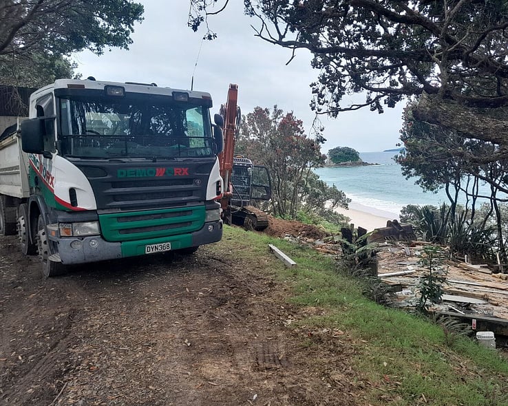 Demoworx truck parked on a coastal site
