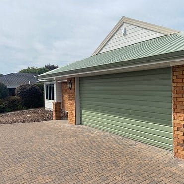 Hamilton home with continuous spouting matching the roof and garage colour
