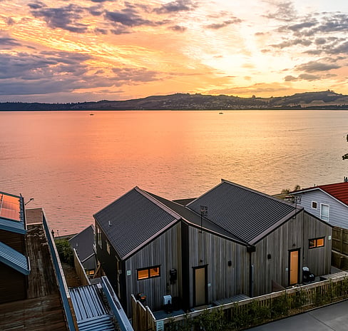 Deck and dining on the lakefront accommodation at Roam, Taupo