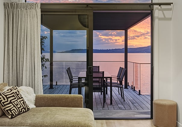 Lake view from a Roam Taupo unit's deck at sunset