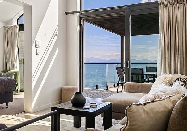 Living room with lake views at a Roam Taupo upper terrace unit