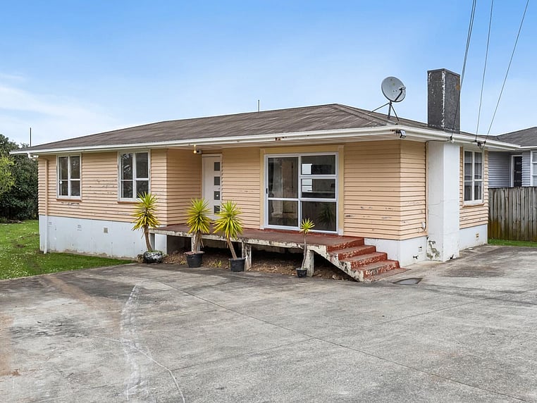  Image of a residential home renovation. Photo of exterior and landscape before renovation.