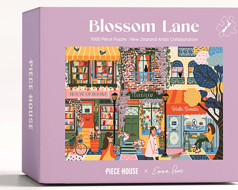 Blossom Lane 1000 Piece Jigsaw Puzzle – beautifully illustrated floral lane scene with vibrant blossoms and intricate details, perfect for puzzle lovers, relaxation, and gifting.