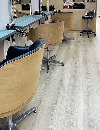 Grey laminate flooring in a hair salon.