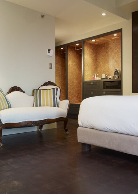 A brown leather floor in a hotel suite.