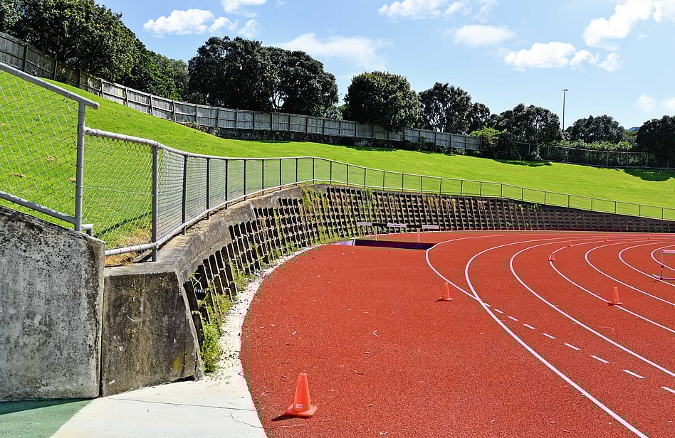 Black aluminimum pool fencing with charcoal composite boundary fence