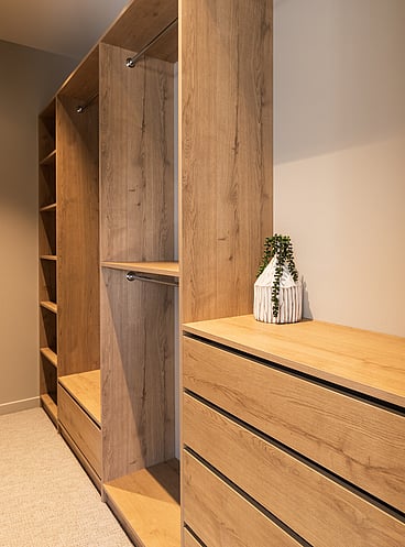 Walk-in wardrobe in natural wood grain