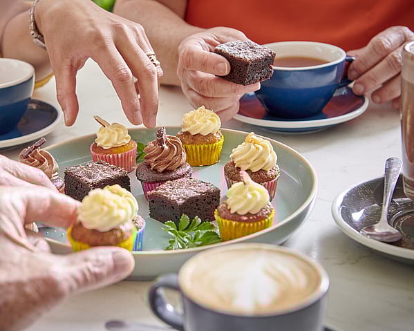 Craig Brown Photographer's image of a group of people sharing mini cupcakes 