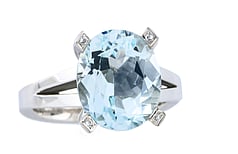 Oval aquamarine with round brilliant diamonds as accents set in 18ct white gold
