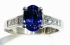 Ceylonese sapphire with princess cut diamonds set in Platinum