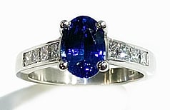 Ceylonese Sapphire with princess cut diamonds set in Platinum