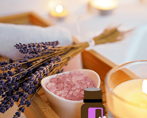 Essential Oils, Candle, Bath Salts and Lavender on a bath tray