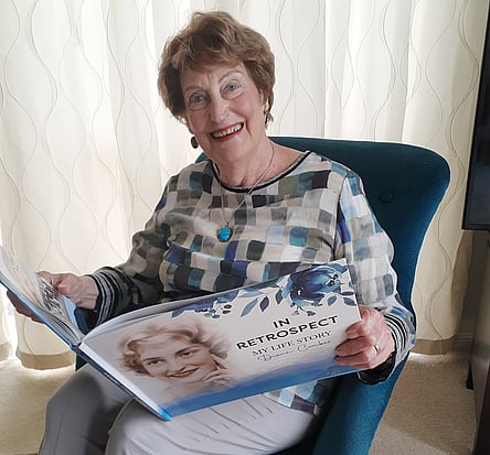 Diane Comber with her life story book