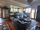 Living room area with kitchen in background