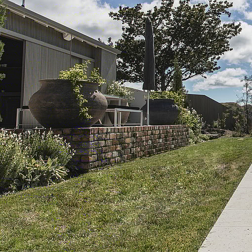 Rock retaining wall constructed by Ultrascape in Rotorua garden