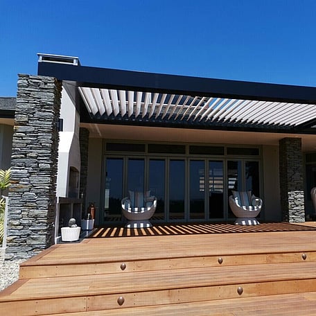 Pacific Lourve with stone pillars and decking installed by Ultrascape