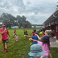 School Holiday programme - image of kids playing outside